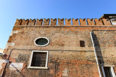 Front view of traditional vintage windows and wall old house in Venice, Italy
