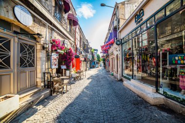 Cesme, Izmir - September 4, 2024: Alacati, Cesme, Izmir. Colorful streets view in Alacati Village. Alacati is populer tourist destination in the Turkey. clipart