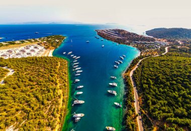 Paradise Bay (Turkish: Cennet Koyu) in Bodrum. Mugla, Turkey. One of the most beautiful bays in Bodrum with blue sea and nature. Drone shot. clipart