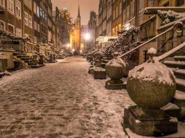 Beautiful historical Mariacka street at night, under snow cover, Danzig, Poland