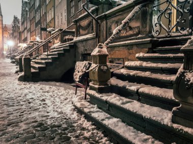 Beautiful historical Mariacka street at night, under snow cover, Danzig, Poland