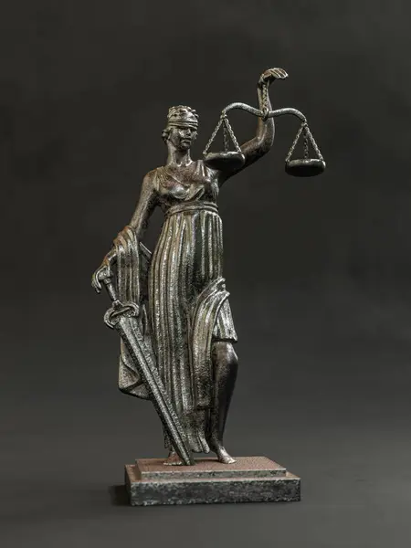 3D rendeing of metal statue of Themis of Justice with balance over black background