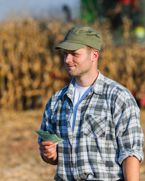 Happy Young Farmer Harvest Corn — Stock Photo, Image