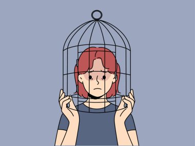 Kafası kuş kafesinde olan mutsuz genç kız ayrımcılık ve özgürlük eksikliğinden muzdarip. Kafese kapatılmış, psikolojik sorunları olan üzgün bir çocuk. Vektör illüstrasyonu. 