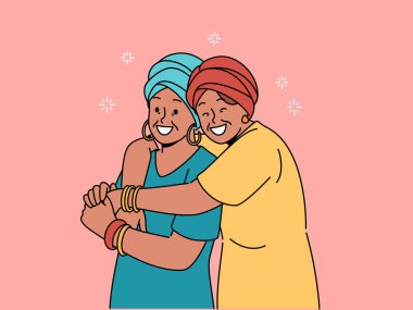 Ulusal Afrika kıyafetleri içinde mutlu yetişkin anne ve kız kucaklaşır, tanışmaktan mutluluk duyarlar. Olgun bir kadın yaşlı bir anneye sarılıyor, iyi yetiştirildiği için şükran duyuyor ve takdir görüyor.