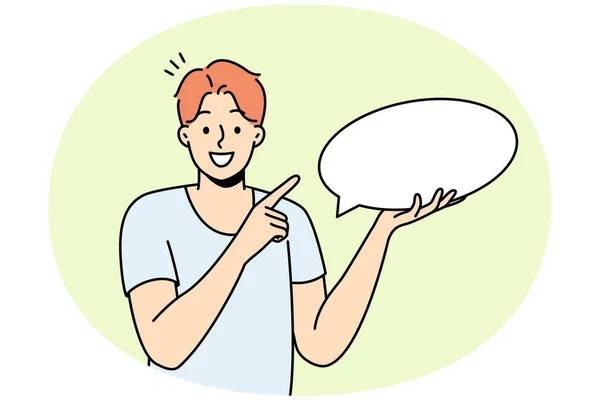 Smiling Young Man Holding Speech Bubble Hands Happy Guy Point — Stock Vector