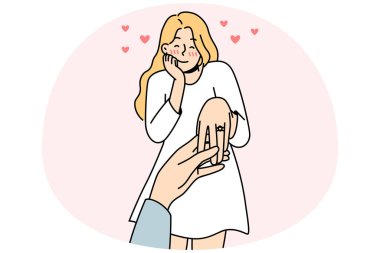 Happy young woman with ring on finger is engaged. Man holding female lover hand make marriage proposal. Ove and relationship. Vector illustration.