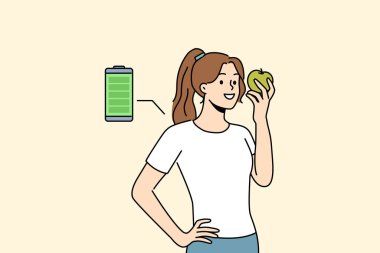 Kadın taze elma yer, enerji ve marketten alınan meyve vitaminleriyle şarj olur. Elma tutan bir kızın yanında tam şarjlı. Kısa sürede gücünü toplamaya yardımcı oluyor.