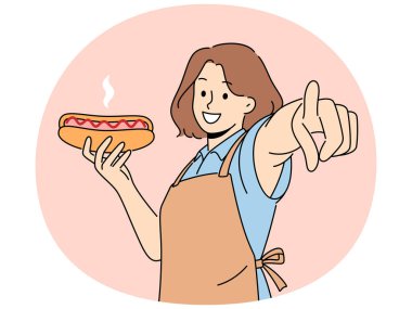Önlüklü gülümseyen kadın ekranda sosisli sandviç tutuyor. Elinde fast food olan mutlu garson, kameraya parmağıyla bakıyor. Vektör illüstrasyonu.