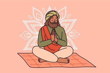 Meditating Indian man fakir prays sitting on mat with mandala sign behind back. Meditating adult guru with beard makes prayer gesture, performing esoteric and spiritualistic practices clipart