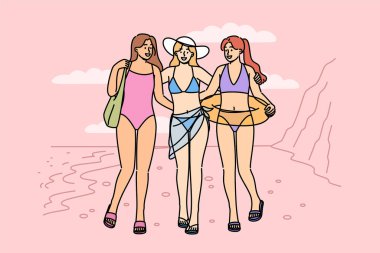 Bikinili kadınlar sahilde yürürler, sıcak bir tatil beldesinde yaz tatilinin tadını çıkarırlar. Üç turist kız kumsalda poz veriyor, sizi güneşlenmek ve yüzmek için tropik adaya davet ediyor.