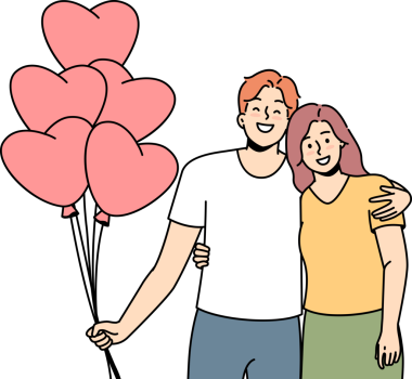 Gülen çift, ellerinde kalp şeklinde balonlar tutarak sarılıyor.