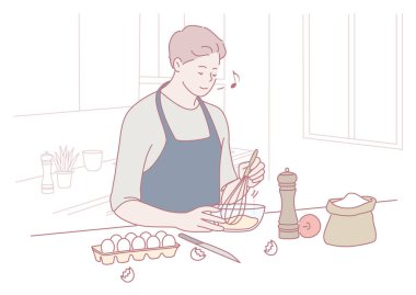 Neşeli bir insan mutfakta yumurta çırparak yemek hazırlar. Mutfak yaratıcılığını gösterir..