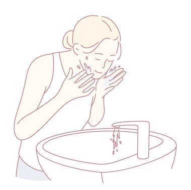 Bir kadın lavaboda yüzünü nazikçe yıkıyor. Basit ama etkili bir cilt göstergesi.