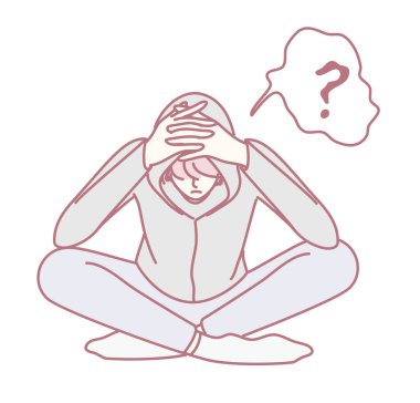 Kapüşonlu biri ellerini başının üstüne koyup derin düşüncelere dalmış ve derin düşüncelere dalmış olarak oturur.