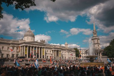 Trafalgar Square, London - UK - 2024.07.27: Crowds of Brits with British flags are gathering at the March for Freedom, March for Britain  clipart