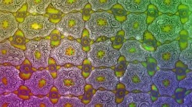 Renkli unsurlarla hareketli arka plan görüntüleri. Mandalas. Eski model. Video kaydı. Şablon. Döngü. Kusursuz..