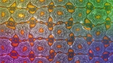 Renkli unsurlarla hareketli arka plan görüntüleri. Mandalas. Eski model. Video kaydı. Şablon. Döngü. Kusursuz..