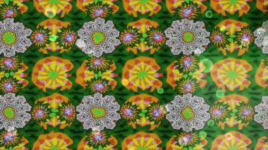 Renkli unsurlarla hareketli arka plan görüntüleri. Çiçekler. Eski model. Bayrak tarzı. Video kaydı. Şablon. Döngü. Kusursuz..