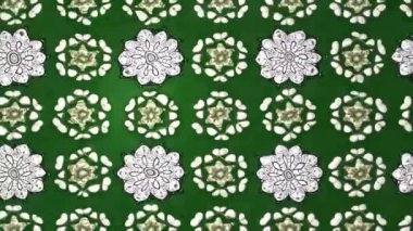 Renkli unsurlarla hareketli arka plan görüntüleri. Çiçekler. Eski model. Bayrak tarzı. Video kaydı. Şablon. Döngü. Kusursuz..