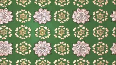 Renkli unsurlarla hareketli arka plan görüntüleri. Çiçekler. Eski model. Bayrak tarzı. Video kaydı. Şablon. Döngü. Kusursuz..