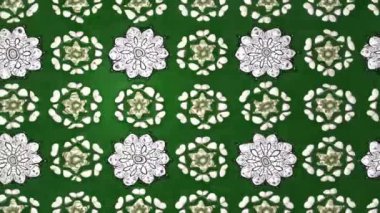 Renkli unsurlarla hareketli arka plan görüntüleri. Çiçekler. Eski model. Bayrak tarzı. Video kaydı. Şablon. Döngü. Kusursuz..