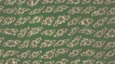 Renkli unsurlarla hareketli arka plan görüntüleri. Çiçekler. Eski model. Bayrak tarzı. Video kaydı. Şablon. Döngü. Kusursuz..