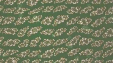 Renkli unsurlarla hareketli arka plan görüntüleri. Çiçekler. Eski model. Bayrak tarzı. Video kaydı. Şablon. Döngü. Kusursuz..