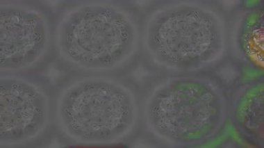 Renkli unsurlarla hareketli arka plan görüntüleri. Çiçekler. Eski model. Bayrak tarzı. Video kaydı. Şablon. Döngü. Kusursuz.. 