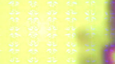 Renkli unsurlarla hareketli arka plan görüntüleri. Çiçekler. Eski model. Bayrak tarzı. Video kaydı. Şablon. Döngü. Kusursuz.. 