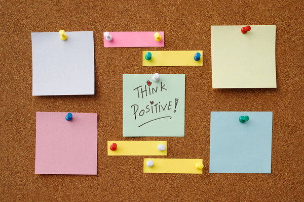 collection of colorful variety post it. paper note reminder sticky notes pin paper blue  on cork bulletin board. empty space for text.