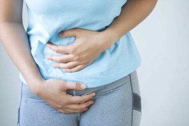 Woman having a stomachache, or menstruation pain. suffering from abdominal. Menstrual cramps. Healthcare and medical, gynecology concept.	