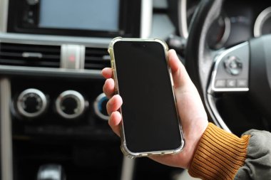Playing with your phone while driving in a car can cause accidents.	
