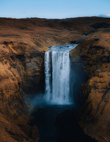 Iceland. Aerial view on the Skogafoss waterfall. Landscape in the Iceland from air. Famous place in Iceland. Landscape from drone. Travel concept. Sunset and sunrise. Soft light