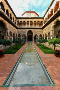 Seville, Spain - Dec 8, 2021: The Royal Alcazar of Seville in Spain. It is the oldest royal palace still in use in Europe.