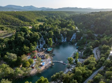 Ljubuski, Bosnia and Herzegovina - Jul 23, 2023: Aerial view of the Kravica Waterfalls in Bosnia and Herzegovina, along the Trebizat River. clipart