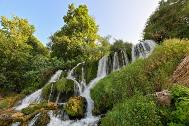 Kravica Waterfalls in Bosnia and Herzegovina, along the Trebizat River. clipart