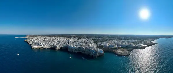 stock image Polignano a Mare drone shot. Aerial view shot of Cala Paura in Puglia, Polignano. Most famous beach in South Italy.