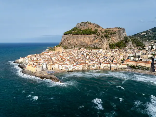 stock image Aerial panorama of famous Cefalu old town with its Norman mediveval cathedral and cliff in Sicily, Italy. The town is a very popular summer holiday destination in Italy.