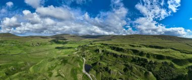 Aerial view of the rocks of Faerie Castle (Castle Ewen) at the Fairy Glen in Isle of Skye in Scotland, UK. clipart