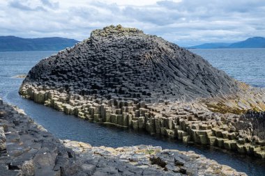 Fingal cave on Staffa island on the coast of Scotland. clipart