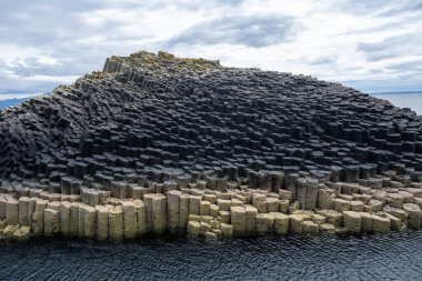 Fingal cave on Staffa island on the coast of Scotland. clipart