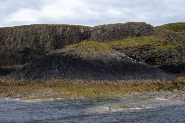 Fingal cave on Staffa island on the coast of Scotland. clipart