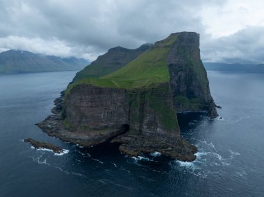 Hills by the Kallur lighthouse of Kalsoy island, Faroe Islands, Denmark. clipart