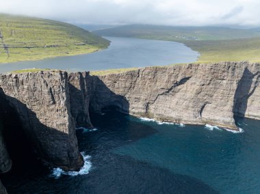 Traelanipa cliffs and Sorvagsvatn Lake on Vagar Island, Faroe Islands clipart