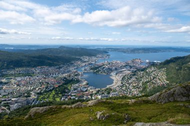 View of Bergen Norway from Ulriken mountain. Ulriken is the highest of the Seven Mountains that surround the city of Bergen, Norway. clipart