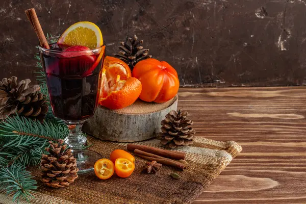 Hot New Years mulled wine, spruce branches, citrus fruits, the atmosphere of Christmas and New Year. High quality photo