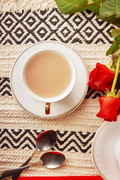 Aesthetic coffee cup with red roses. Lagom holiday background. Coffee time.