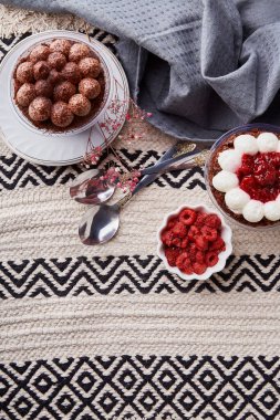 Aesthetic vegan dessets. Trendy no baking, gluten free raspberry, cherry cupcakes flat lay. Dreamy Escapism concept.