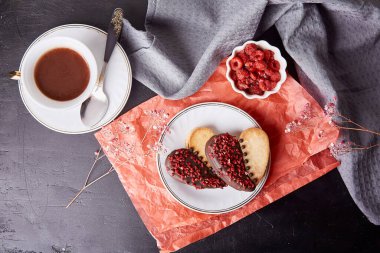 Vegan cookies in shape of heart, raspberries taste. Aesthetic, romantic St Valentines cookies. Lagom holiday food background